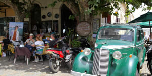 Colonia's quirky El Drugstore cafe,where vintage cars have been parked outside and remodelled into seating booths.