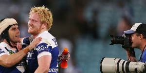 Michael Ennis and James Graham of the Bulldogs in 2014.