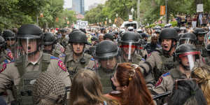 Texas state troopers in riot gear try to break up a pro-Palestinian protest at the University of Texas on Wednesday.