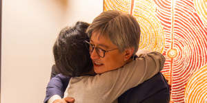 Foreign Minister Penny Wong and journalist Cheng Lei embrace as she returns to Australia.