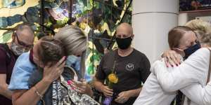 Families reunite at Sydney airport after the border reopened on November 1.