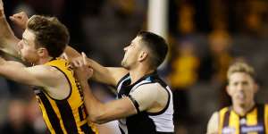 Ryan Burton (right) playing against his old side Hawthorn.