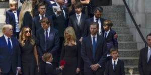 Former President Donald Trump,far left,stands with his family as the casket of Ivana Trump leaves following her funeral in New York.
