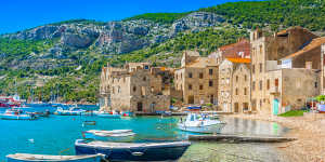 The island of Vis is a pile of limestone cliffs,olive groves and vineyards.