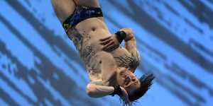 French men’s diving champion Matthieu Rosset is appropriately dressed for French pools where shorts-style bathers are banned. 