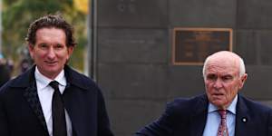 Former AFL player James Hird (left) and ex-Essendon chairman Paul Little arrive.