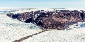 Greenland is one of the world's most sparsely inhabited places,and the last major landmass to be settled by humans. Most of it is buried under ice. The rest is rock and tundra,a green-grey world of hard edges and great silences. 