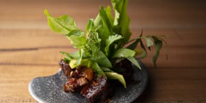 Sticky aged pork surrounded by fresh Thai herbs and leaves. 