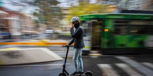 An e-scooter rider in Melbourne’s CBD.