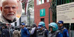 Security personnel guard the main gate of Jamia Millia Islamia university in New Delhi,India,Wednesday,Jan. 25,2023. Tensions escalated in the university after a student group said it planned to screen a banned documentary that examines Indian Prime Minister Narendra Modi’s role during 2002 anti-Muslim riots,prompting dozens of police equipped with tear gas and riot gear to gather outside campus gates. 