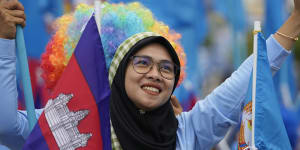 A supporter of the Cambodian People’s Party participates in a procession in Phnom Penh.