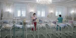 Nurses care for newborn babies at a hotel in Kyiv,Ukraine. During the pandemic,many babies could not be picked up due to border closures. 