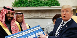 March 2018:President Trump holds a chart highlighting $US12.5 billion in arms sales to Saudi Arabia during a meeting with Saudi Crown Prince Mohammed bin Salman in the Oval Office.