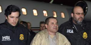 US authorities escort Mexican drug lord Joaquin “El Chapo” Guzman from a plane in New York last year.