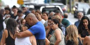 Emotional scenes at the site of Saturday's crash,in which four children were killed.