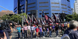 Premier Steven Miles with daughter and fellow state MPs leads the annual Labour Day March in Brisbane this morning. 