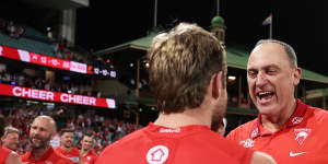 Swans coach John Longmire celebrates with Braeden Campbell.