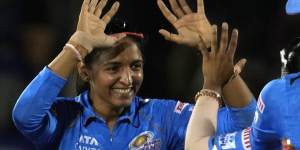 Mumbai Indians captain Harmanpreet Kaur,left,celebrates the dismissal of Meg Lanning during the Women’s Premier League Twenty20 cricket final.