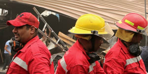 Workers search for bodies after a catastrophic blaze destroyed a COVID-19 ward at a hospital in Nassiriya,Iraq.