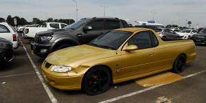 A Holden ute without number plates in a long-term car park.