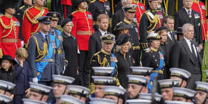 Prince Andrew,Princess Beatrice,Princess Anne,Camilla,the Queen Consort,Britain’s King Charles III,Meghan,Duchess of Sussex,Prince Harry,Prince William,Prince George and Princess Charlotte watch as the coffin of Queen Elizabeth II is placed into the hearse following the state funeral service in Westminster Abbey.