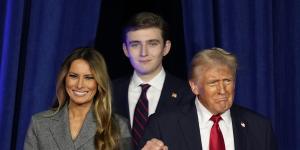 Donald Trump,joined by Melania Trump and Barron Trump,arrives to speak at his election night watch party.