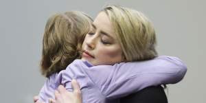 Amber Heard hugs her lawyer Elaine Bredehoft after the verdict was read.