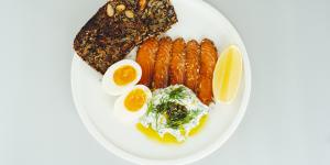 Breakfast plate with za’atar,ocean trout,boiled egg and mountain bread.