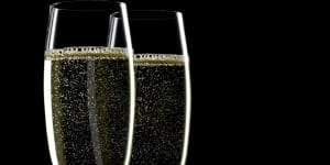 Two glass of champagne on black background ChampagneÂ iStock