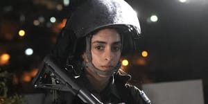 Police are present before the release of Palestinian prisoner Israa Jaabis as part of a deal between Israel and Hamas on November 26 in the Jabel Mukaber neighbourhood of East Jerusalem. 