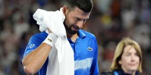 Novak Djokovic leaves centre court for a medical timeout.