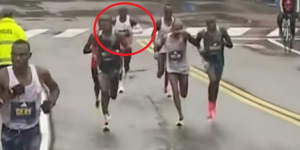 Eliud Kipchoge falls back as Gabriel Geay makes a break at the 30km mark in this year’s Boston marathon.