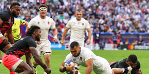 Joe Marchant scores for England against Fiji in their Rugby World Cup quarter-final in Marseille.