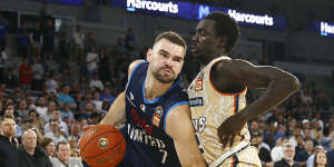 Humphries playing for Melbourne United last October,under pressure from Bul Kuol of the Cairns Taipans.