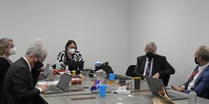 Delegates convene in a room as discussions continue at the COP26 Summit in Glasgow,Scotland,on Friday.