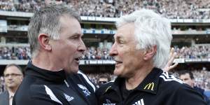 Geoff Walsh (left) and coach Mick Malthouse helped the Magpies to the 2010 premiership.