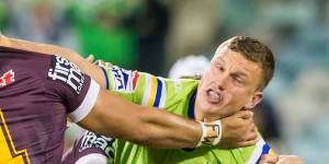 Jack Wighton tries to fend off Brisbane's Alex Glenn.