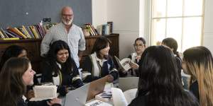 Hornsby Girls High School English head Teacher Richard Strauss with year 12 students. 