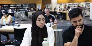 Mia Atkinson and Sharif Barez had to use the internet at Blacktown library. 