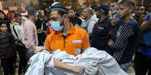 Palestinians injured in Israeli air raids arrive at Nasser Medical Hospital in Khan Yunis.