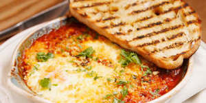 Huevos madrilenos (baked eggs with chorizo and black pudding).