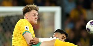 Socceroos defender Harry Souttar gets his boot to the ball against Saudi Arabia.