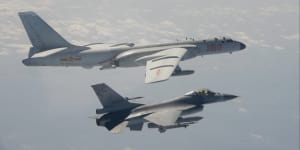 A Taiwan Air Force F-16 fighter jet flies alongside a Chinese H-6K bomber during an earlier incursion.