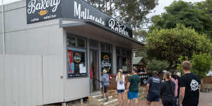 A queue for service at the Mallacoota Bakery on Friday.