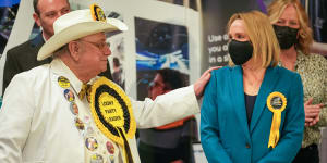 Alan ‘Howling Laud’ Hope,Official Monster Raving Loony Party,congratulates North Shropshire by-election winner Helen Morgan of the Liberal Democrats in Shrewsbury,England,on Friday.