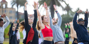 Going with the flow:An early-morning New Year’s Day yoga class at St Kilda beach.