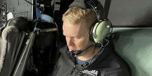 New Zealand Prime Minister Chris Hipkins in a military plane bound for Auckland to assess the rain and flooding damage on Saturday.