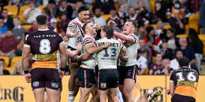 Roosters run away with victory against bruised Broncos