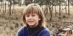 Annabel Johnson as a child helping out on the farm in Young.