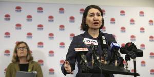 Then-NSW premier Gladys Berejiklian gives a COVCID update in 2020. Data analysts had to track press conferences to learn the latest COVID numbers.